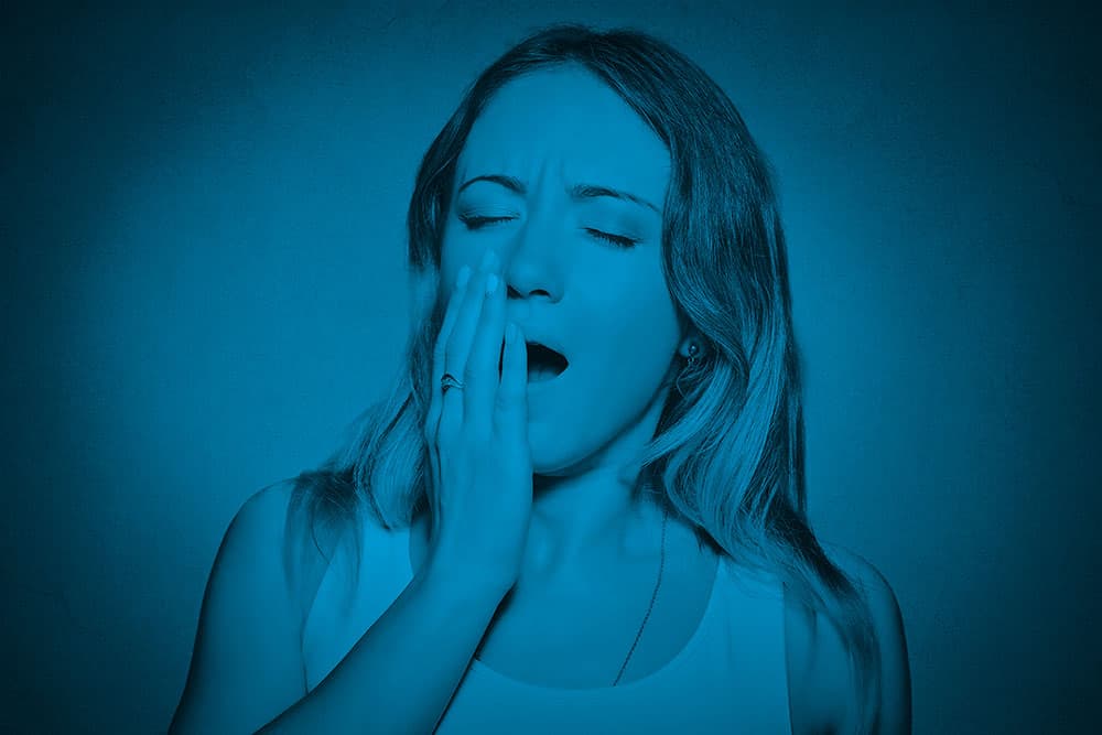 A woman yawning