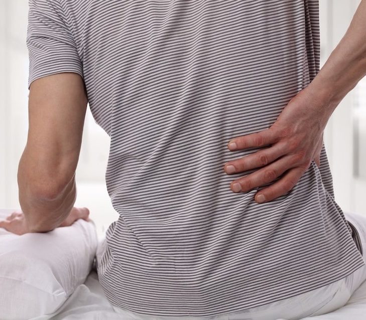 man experiencing back pain