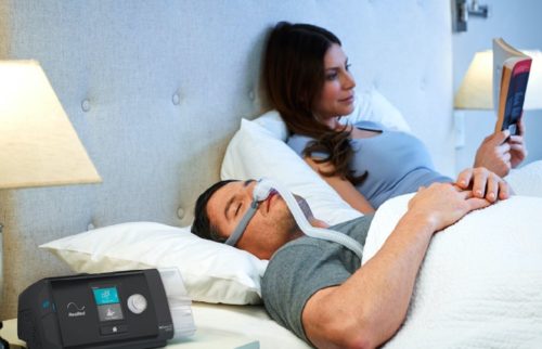 couple in bed man wearing Airfit p10