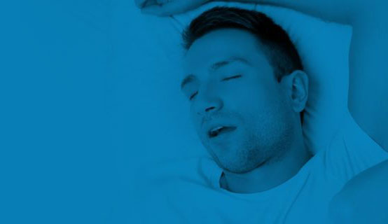 Close up of snoring man in bed